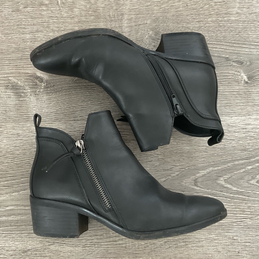 Black ankle boots with zipper accent and short heel